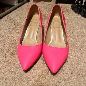 Neon pink pumps